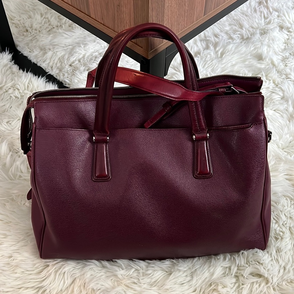 TUMI laptop bag in rich purple leather